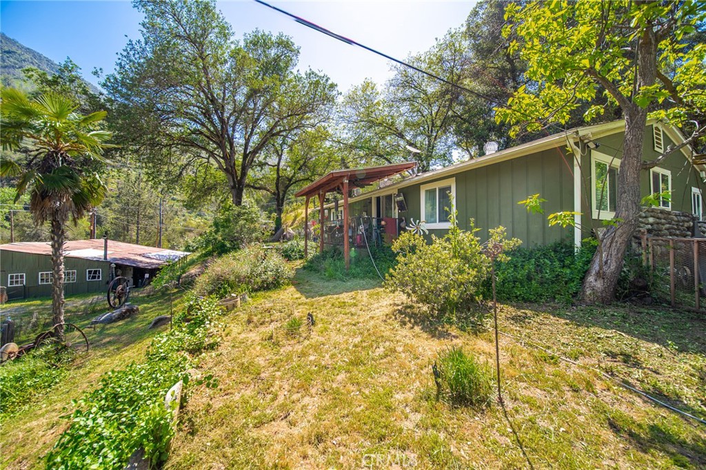 10049 Incline Road El Portal, CA 95318 - Photo 19 of 44 a backyard of a house with yard and outdoor seating
