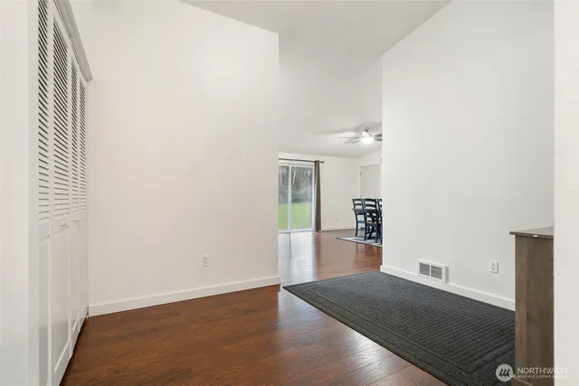 an empty room with wooden floor