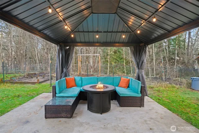 a outdoor space with patio lots of furniture and garden view