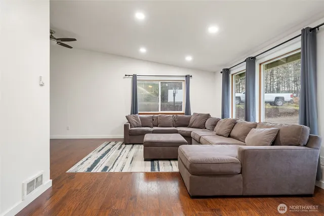 a living room with furniture and a large window