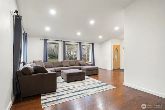 a living room with furniture and a large window