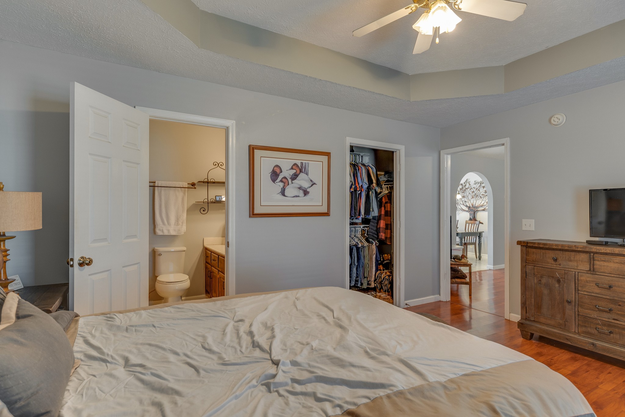 140 Cora Street Portland, TN 37148 - Photo 16 of 27 a bedroom with a bed and a chandelier