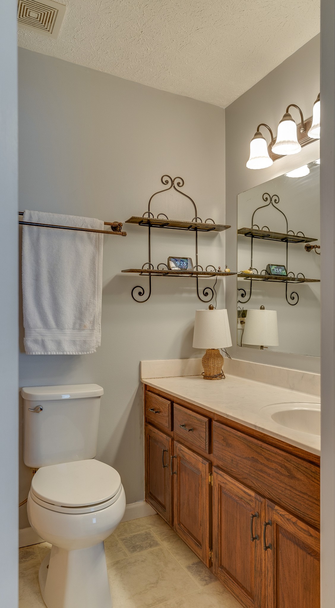 140 Cora Street Portland, TN 37148 - Photo 17 of 27 a bathroom with a granite countertop sink a toilet and a mirror
