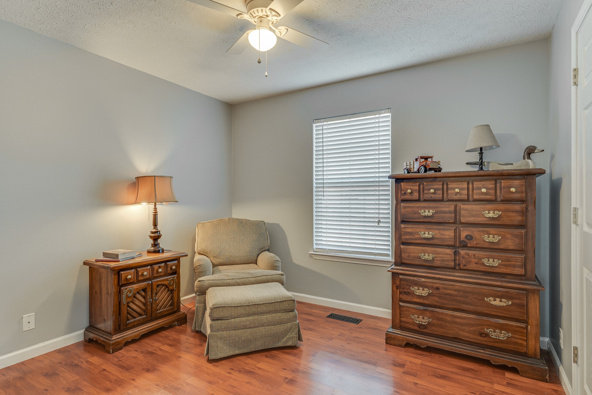 140 Cora Street Portland, TN 37148 - Photo 20 of 27 a bedroom with a bed and a chandelier