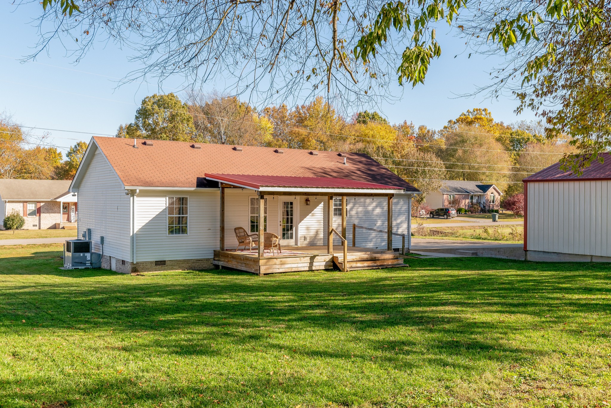 140 Cora Street Portland, TN 37148 - Photo 25 of 27 a front view of a house with a garden and trees
