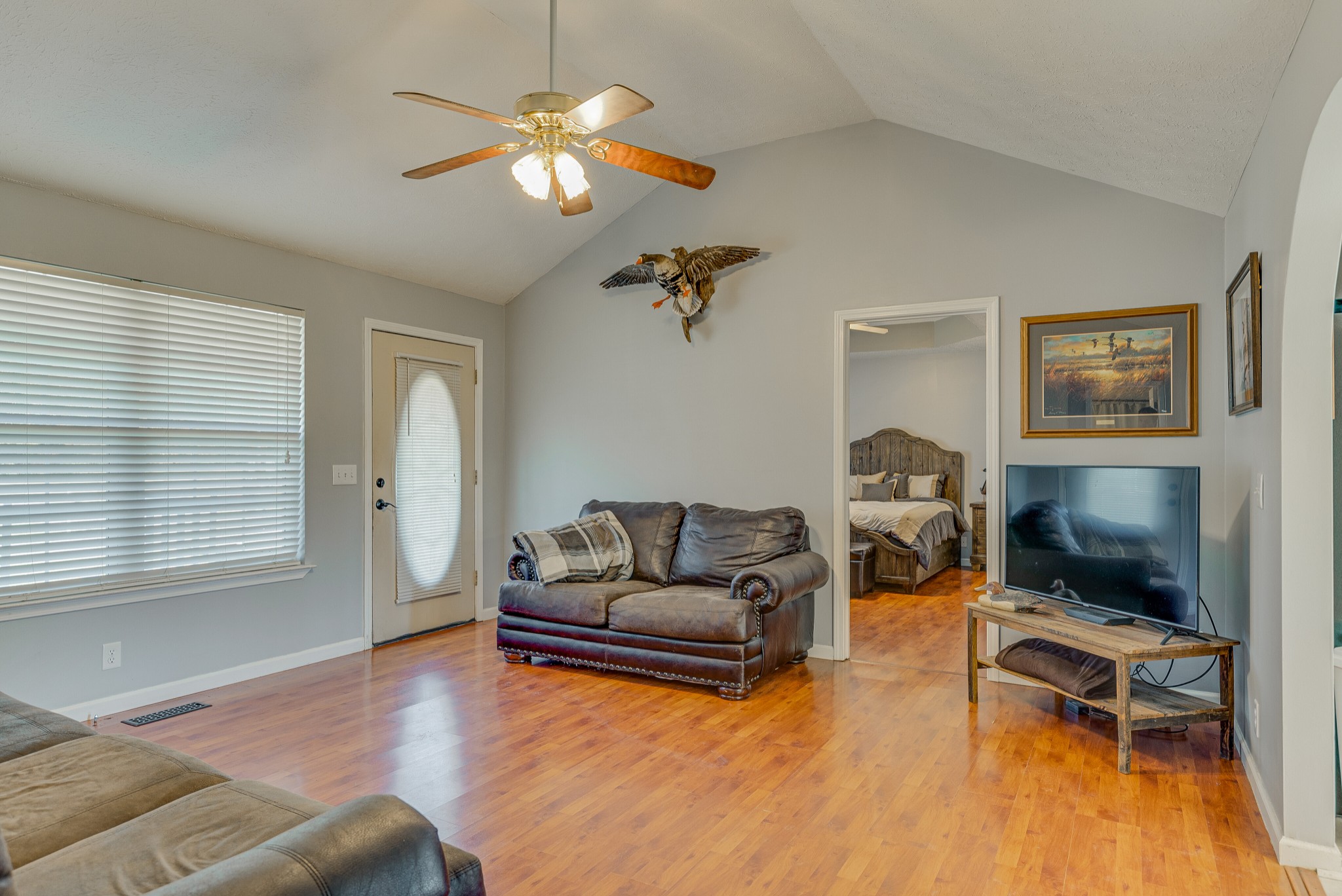 140 Cora Street Portland, TN 37148 - Photo 7 of 27 a living room with furniture a flat screen tv and a window