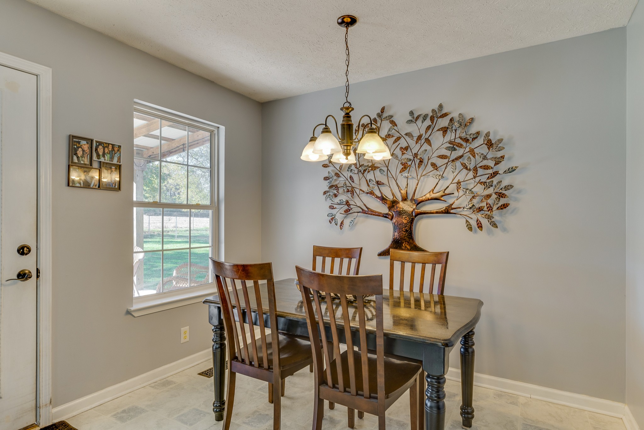 140 Cora Street Portland, TN 37148 - Photo 8 of 27 a view of a dining room with furniture and chandelier
