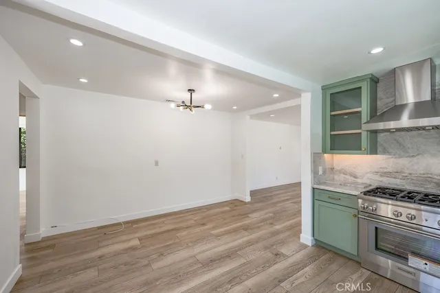 a kitchen with a stove and a refrigerator