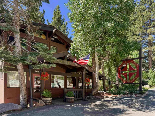 a view of a building with traffic signal lights