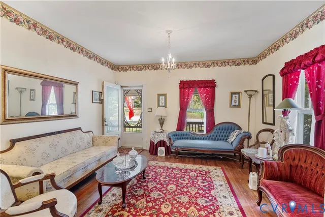 a living room with furniture and a rug