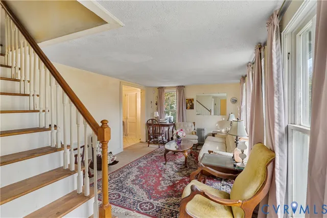 a living room with furniture and a table