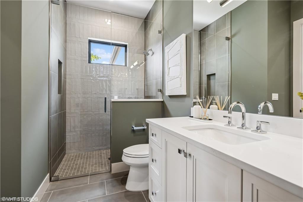 19080 Via Messina Way Miromar Lakes, FL 33913 - Photo 11 of 49 a bathroom with a sink toilet and shower