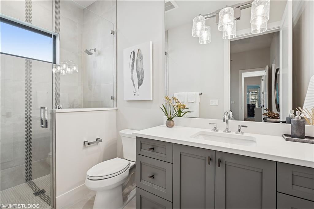 19080 Via Messina Way Miromar Lakes, FL 33913 - Photo 14 of 49 a bathroom with a sink toilet and shower