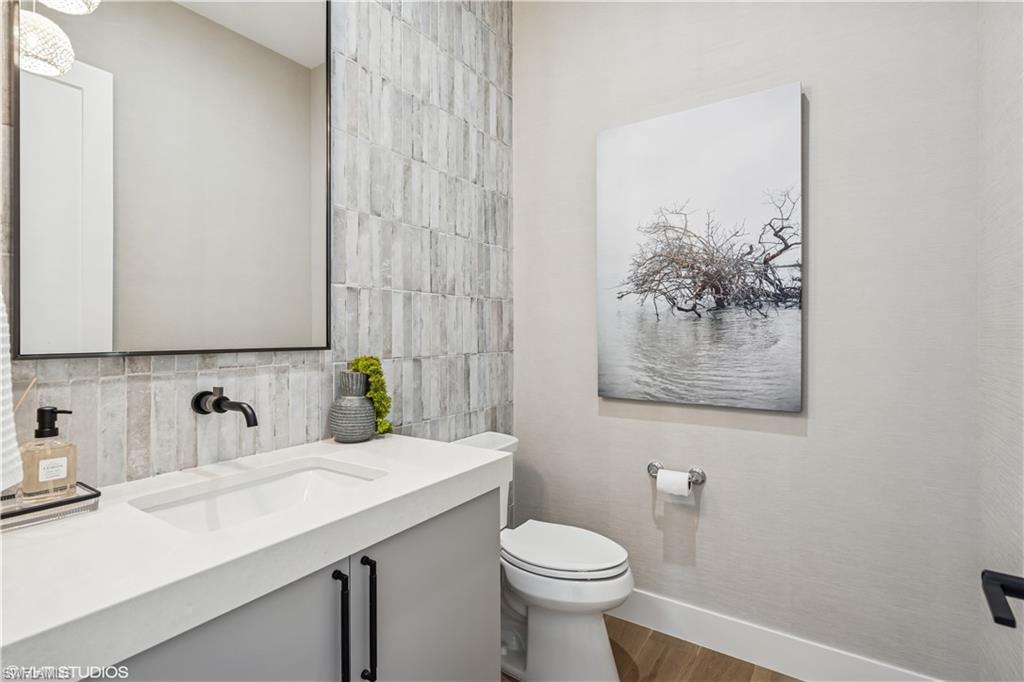 19080 Via Messina Way Miromar Lakes, FL 33913 - Photo 28 of 49 a bathroom with a sink and a toilet