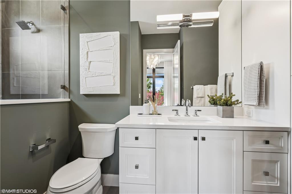 19080 Via Messina Way Miromar Lakes, FL 33913 - Photo 39 of 49 a bathroom with a sink a toilet and shower