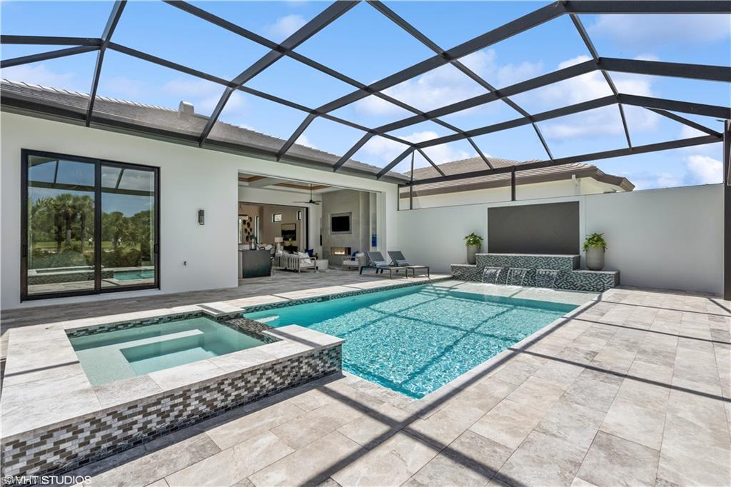 19080 Via Messina Way Miromar Lakes, FL 33913 - Photo 45 of 49 a view of a backyard with a patio