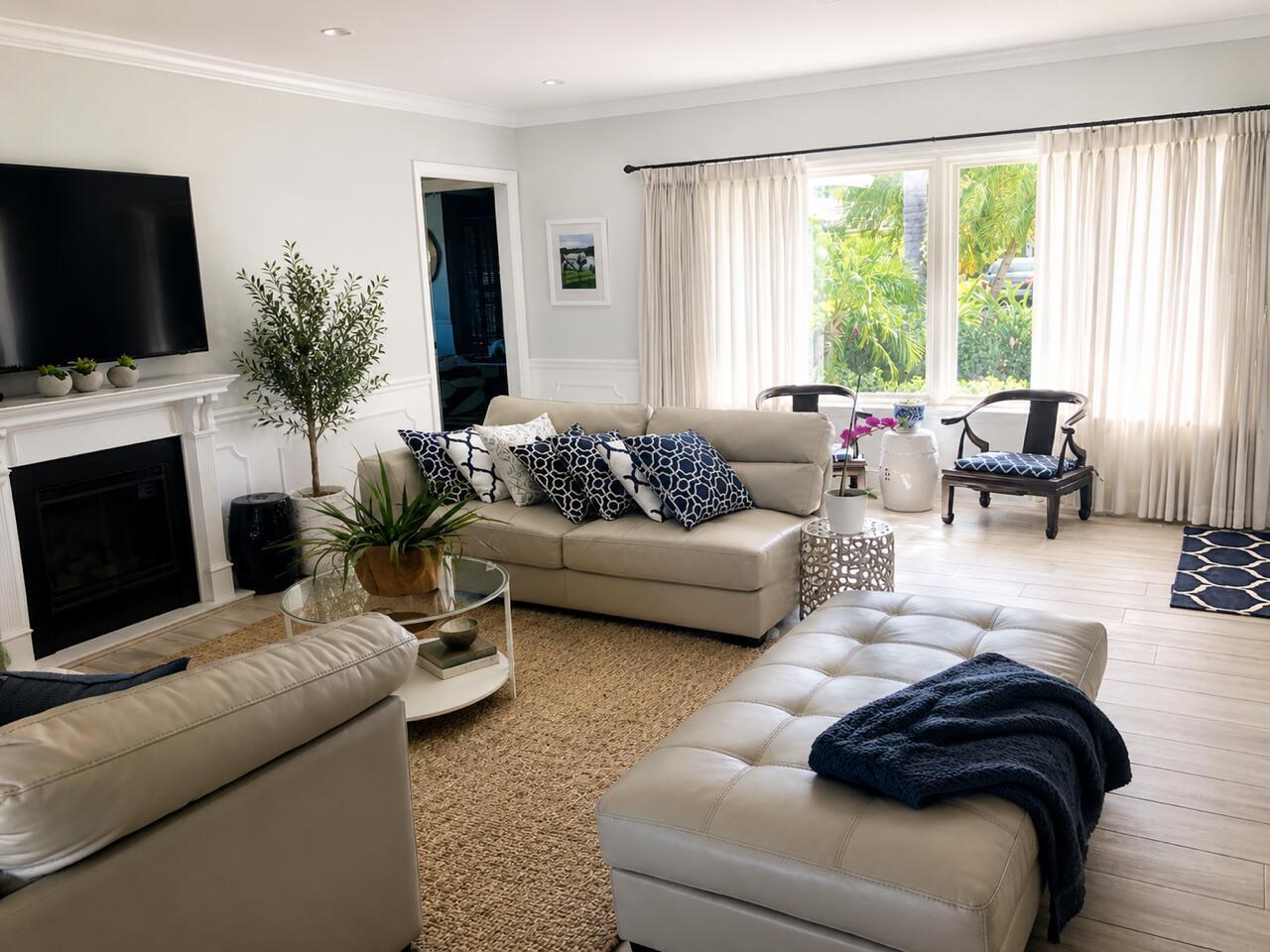 1111 Pepperridge Terrace Boca Raton, FL 33486 - Photo 4 of 8 a living room with furniture fireplace and flat screen tv