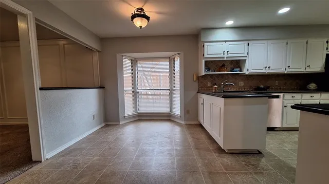 a bathroom with a sink a mirror and a shower