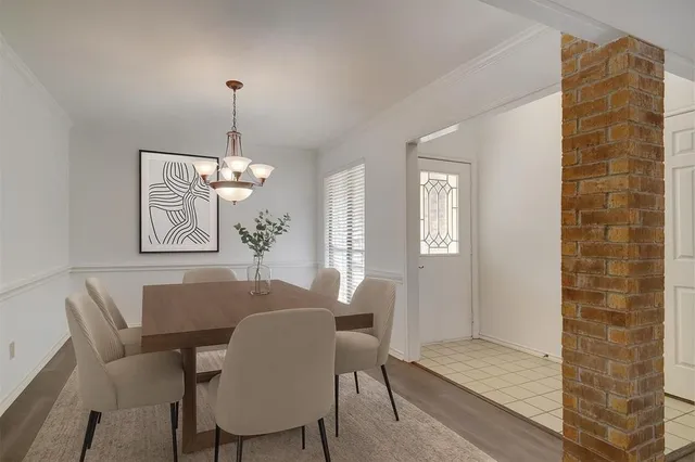 a kitchen with stainless steel appliances granite countertop a sink and dishwasher a stove top oven with white cabinets