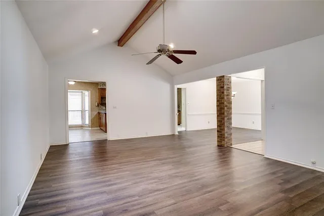 a kitchen with stainless steel appliances granite countertop a sink and a stove