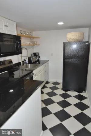a kitchen with a sink and a microwave
