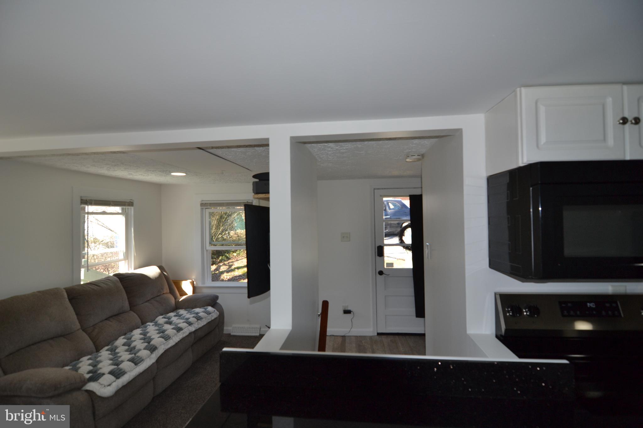 1410 West Locust Street York, PA 17404 - Photo 15 of 23 a living room with furniture and wooden floor