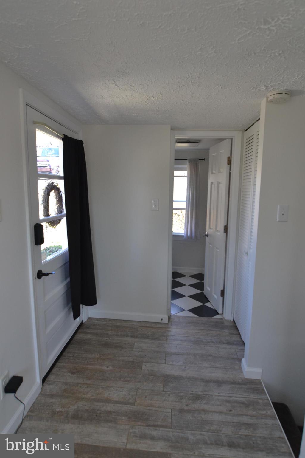 1410 West Locust Street York, PA 17404 - Photo 10 of 23 a view of a hallway with wooden floor and a living room