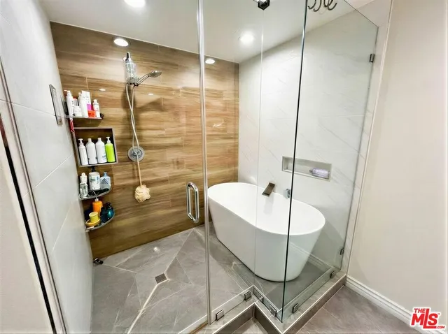 a white bath tub sitting in a bathroom