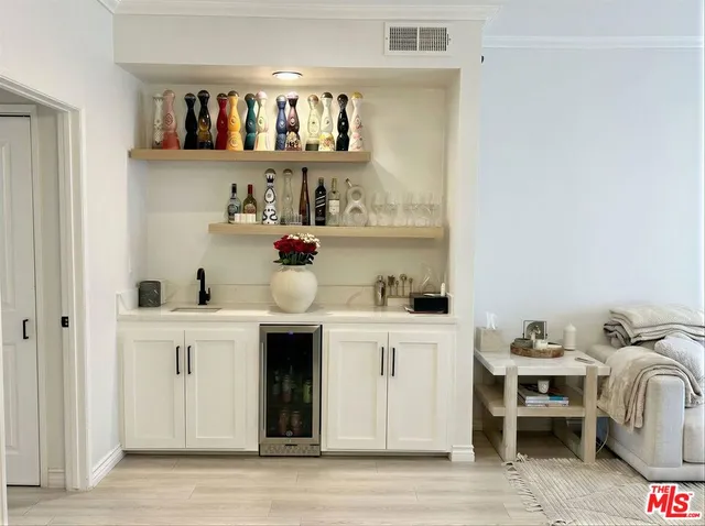 a kitchen with a sink a stove and cabinets