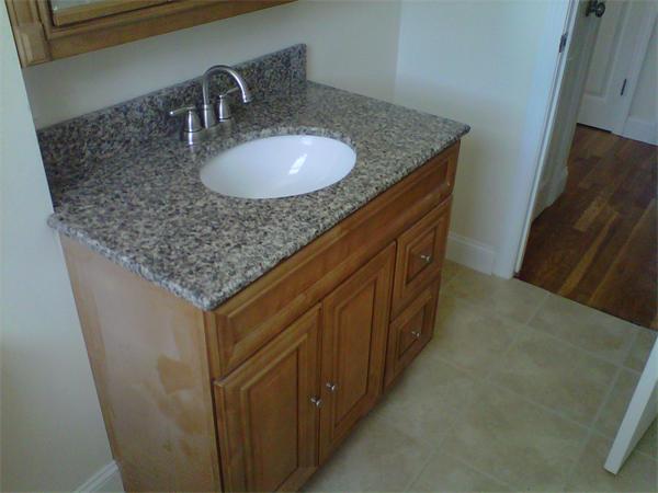 241 Salem Road Billerica, MA 01821 - Photo 10 of 24 a bathroom with a granite countertop sink and a mirror