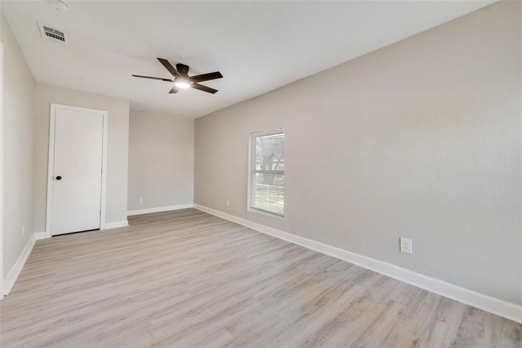 109 Lydia Street Terrell, TX 75160 - Photo 16 of 22 wooden floor in an empty room with a window