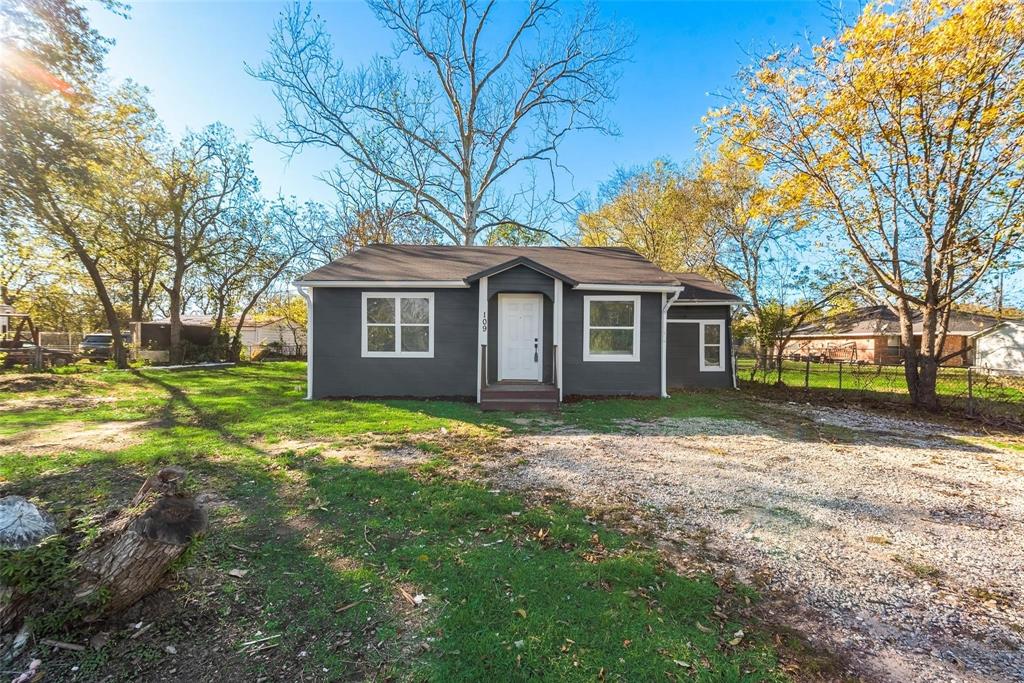 109 Lydia Street Terrell, TX 75160 - Photo 20 of 22 a view of a yard in front of a house with large trees