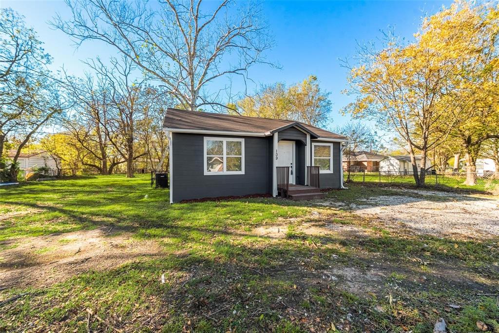 109 Lydia Street Terrell, TX 75160 - Photo 22 of 22 a view of a yard in front of a house with large trees