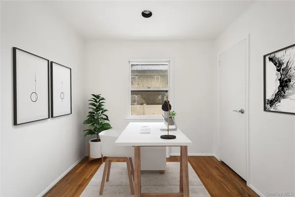 a view of a workspace with furniture