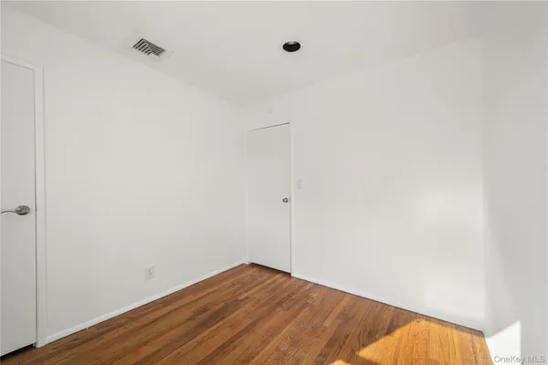 a view of small space with wooden floor