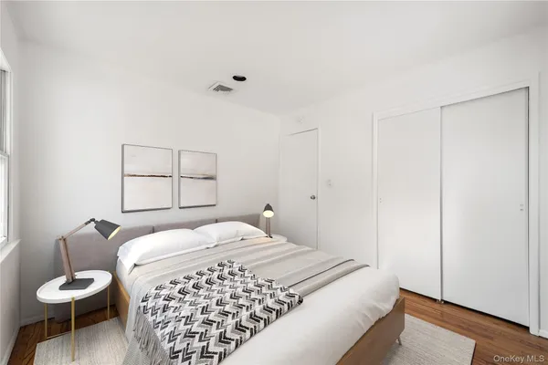 a bedroom with a bed and chair