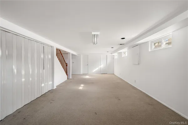 a view of a room with closet and utility room