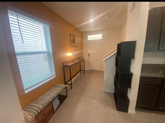 a view of a hallway with seating area