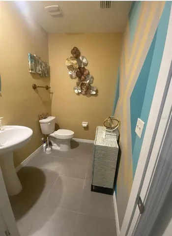 a room with a flat screen tv and a window