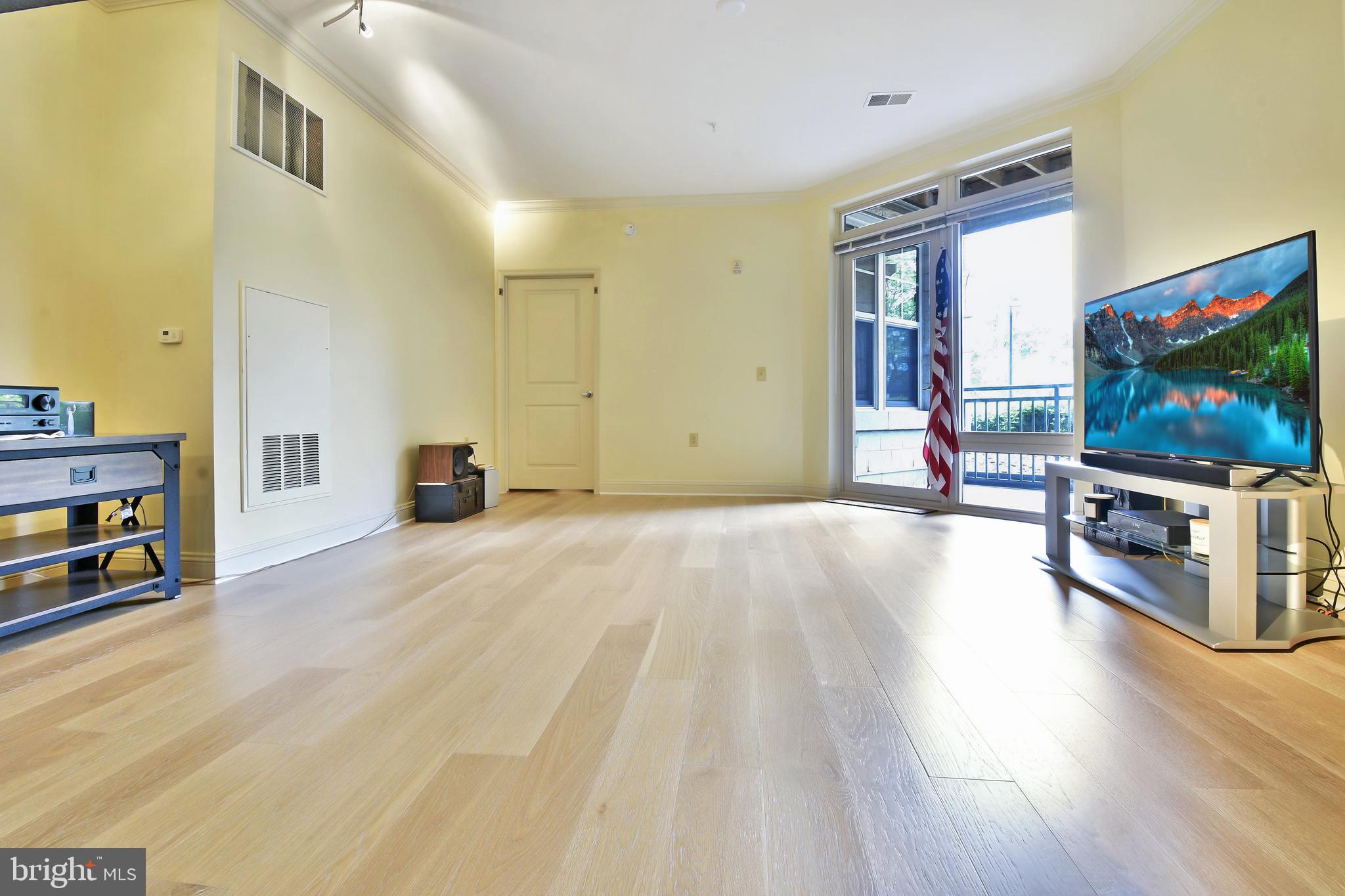 11770 Sunrise Valley Drive, Unit 120 Reston, VA 20191 - Photo 15 of 41 a view of a livingroom with furniture and a flat screen tv