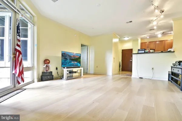 a view of a livingroom with furniture and a flat screen tv