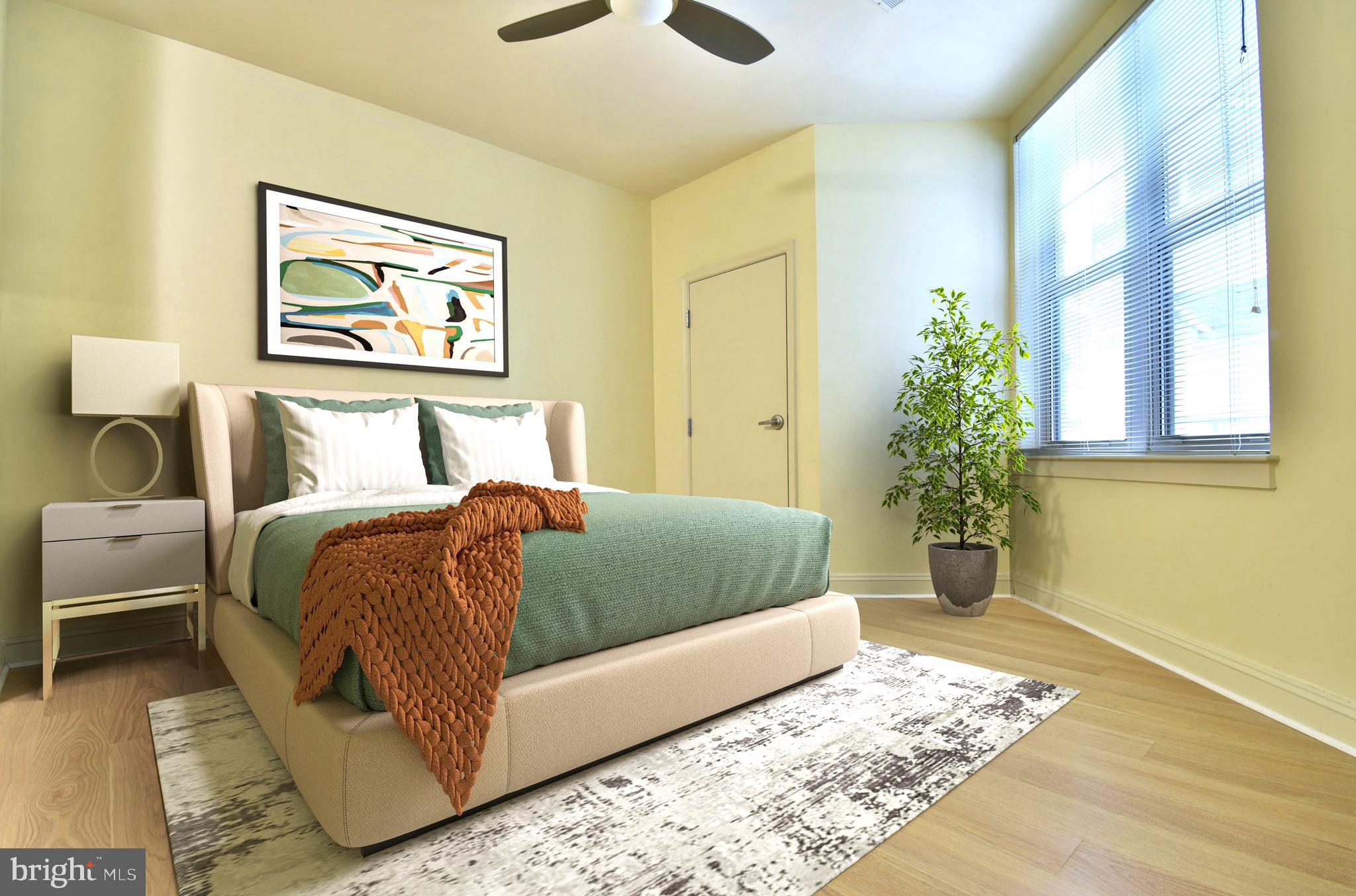 11770 Sunrise Valley Drive, Unit 120 Reston, VA 20191 - Photo 20 of 41 a bedroom with a bed and a painting on the wall