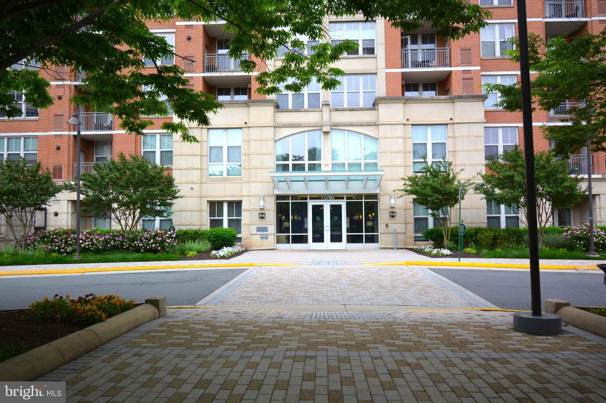 11770 Sunrise Valley Drive, Unit 120 Reston, VA 20191 - Photo 3 of 41 a front view of a building with street