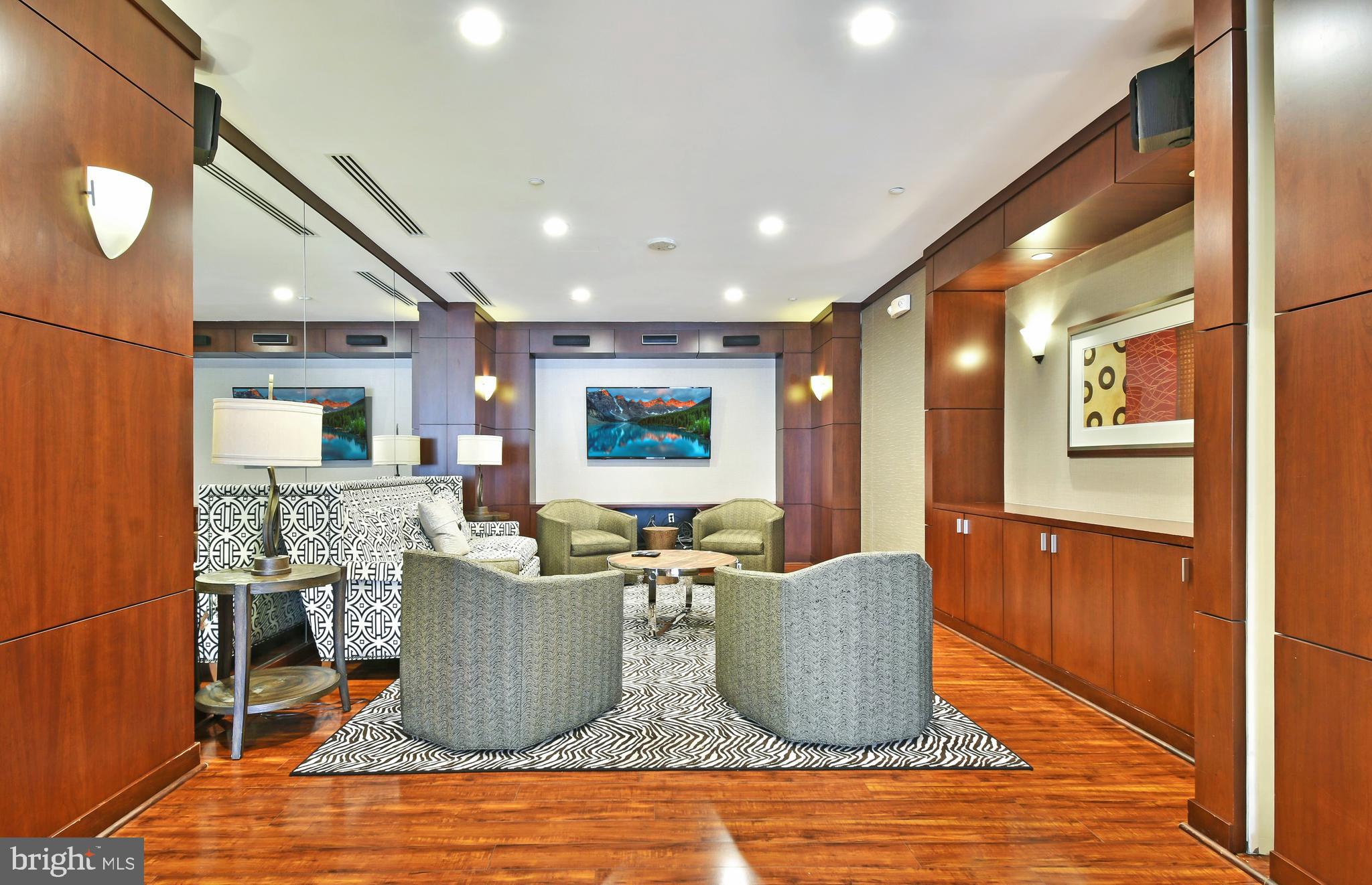 11770 Sunrise Valley Drive, Unit 120 Reston, VA 20191 - Photo 38 of 41 a living room with furniture a wooden floor and a large window