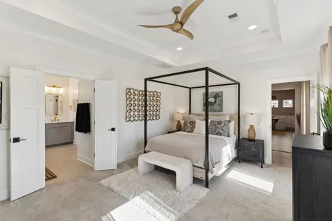 a bathroom with a tub a sink and a shower