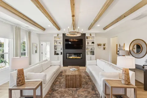 a living room with furniture and a clock