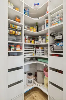 a kitchen with stainless steel appliances granite countertop a sink a stove and a refrigerator