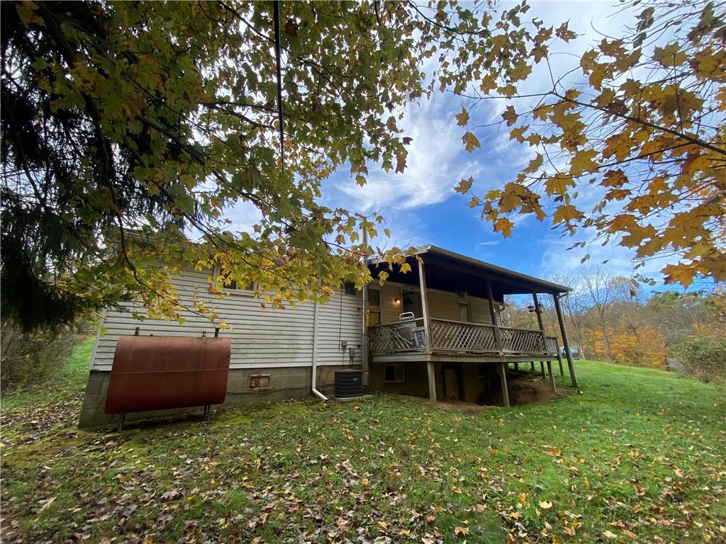290 Calverts Hill Road Spraggs, PA 15362 - Photo 1 of 22 a house view with a garden space