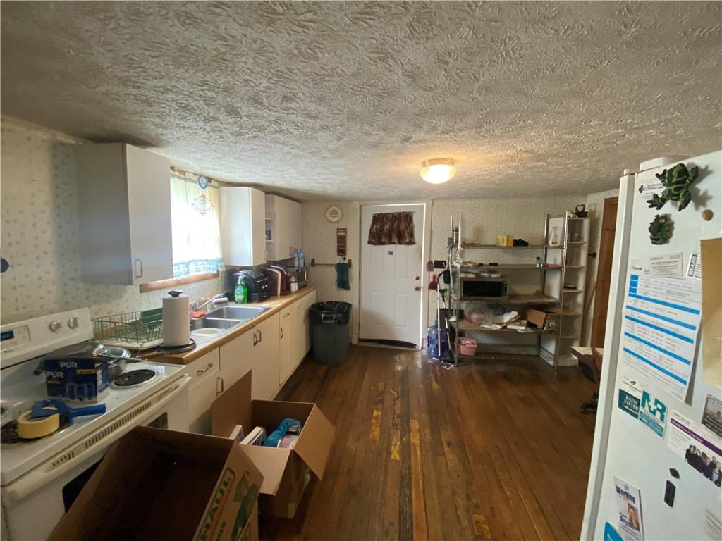 290 Calverts Hill Road Spraggs, PA 15362 - Photo 12 of 22 a kitchen with a sink appliances and cabinets