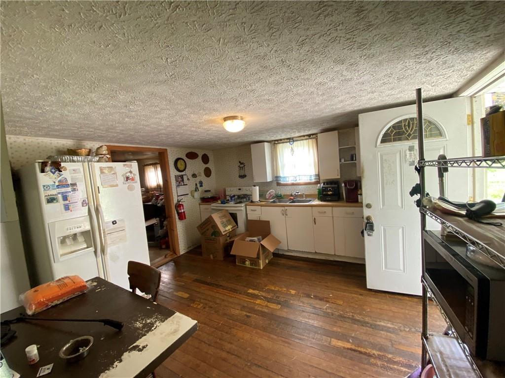290 Calverts Hill Road Spraggs, PA 15362 - Photo 13 of 22 a view of a kitchen with fridge and workspace
